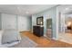 Light-filled bedroom with hardwood floors, a dresser, and neutral décor at 32430 Archdale, Chapel Hill, NC 27517