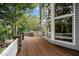 Spacious wooden deck with stone railing, barbeque and expansive views at 32430 Archdale, Chapel Hill, NC 27517