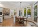 Bright dining area with views of the outdoors and access to the deck and the living room at 32430 Archdale, Chapel Hill, NC 27517