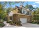 Charming home featuring stone and siding exterior, attached garage, and beautifully landscaped yard at 32430 Archdale, Chapel Hill, NC 27517