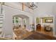 Grand two-story foyer with hardwood floors leading to the living and dining areas, enhanced by elegant lighting at 32430 Archdale, Chapel Hill, NC 27517