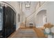 Grand two-story foyer with hardwood floors, elegant lighting, a staircase and a decorative front door with glass panels at 32430 Archdale, Chapel Hill, NC 27517