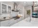 Beautiful kitchen with custom tile backsplash, stainless steel appliances, and modern fixtures at 32430 Archdale, Chapel Hill, NC 27517