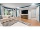 Inviting living room with stylish decor, a comfortable sofa, and a large TV for ultimate relaxation at 32430 Archdale, Chapel Hill, NC 27517
