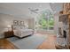 Serene main bedroom with vaulted ceilings, large windows, and a cozy stone fireplace at 32430 Archdale, Chapel Hill, NC 27517