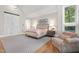 Bright main bedroom showcasing a seating area and ample natural light at 32430 Archdale, Chapel Hill, NC 27517