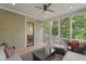 Comfortable sunroom with tiled floors, ceiling fan and views of the backyard at 32430 Archdale, Chapel Hill, NC 27517