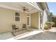 Relaxing covered back patio includes ceiling fan and exterior door at 379 Tobacco Farm Way, Chapel Hill, NC 27516