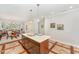 Bright kitchen featuring a center island, pendant lighting, and open access to the dining and living areas at 379 Tobacco Farm Way, Chapel Hill, NC 27516