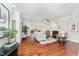 Open concept living room with hardwood floors, fireplace, and plenty of natural light at 379 Tobacco Farm Way, Chapel Hill, NC 27516