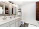 A bathroom features double sinks and a vanity with unique framed mirrors at 411 Lawton Dr, Haw River, NC 27258