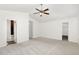A bright bedroom featuring neutral carpet, and a modern ceiling fan at 411 Lawton Dr, Haw River, NC 27258