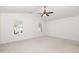 Bright and spacious bedroom with large windows, neutral carpet, and a contemporary ceiling fan at 411 Lawton Dr, Haw River, NC 27258