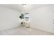 Bedroom features a large window, neutral carpet, and a white desk with a houseplant at 411 Lawton Dr, Haw River, NC 27258