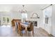Elegant dining room with wood floors, a fireplace, and a rustic table perfect for Gathering meals at 411 Lawton Dr, Haw River, NC 27258