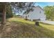 A sloping backyard with a fence, leading up to a house with a white exterior at 4228 Nc 42 Hwy, Raleigh, NC 27603