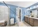 Bathroom featuring walk-in shower, double vanity with granite countertop and tile flooring at 4228 Nc 42 Hwy, Raleigh, NC 27603