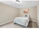 This neutral bedroom offers a comfortable space with carpet and a stylishly made bed at 4228 Nc 42 Hwy, Raleigh, NC 27603