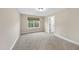 Carpeted bedroom with natural light and a window with a view of the backyard at 4228 Nc 42 Hwy, Raleigh, NC 27603