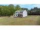 This charming two-story home boasts a fenced yard, a front porch, and a manicured lawn at 4228 Nc 42 Hwy, Raleigh, NC 27603
