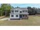 Charming two-story home with symmetrical facade, inviting porch, and well-manicured lawn at 4228 Nc 42 Hwy, Raleigh, NC 27603