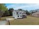 This two-story home boasts a fenced yard, two-car garage, and inviting front porch at 4228 Nc 42 Hwy, Raleigh, NC 27603