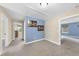 Hallway featuring multiple doorways and artwork in soft, neutral tones and carpeted floor at 4228 Nc 42 Hwy, Raleigh, NC 27603