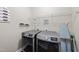 This functional laundry room offers a laundry schedule and modern, front-loading washer and dryer at 4228 Nc 42 Hwy, Raleigh, NC 27603