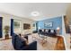Comfortable living room with hardwood floors and a blue accent wall at 4228 Nc 42 Hwy, Raleigh, NC 27603