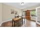 Bright home office with hardwood floors, custom built in bookcase, and natural light at 4228 Nc 42 Hwy, Raleigh, NC 27603