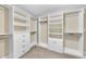 Walk-in closet with custom white shelving and drawers, providing ample storage space at 4228 Nc 42 Hwy, Raleigh, NC 27603