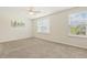 Bright and airy bedroom featuring large windows and neutral carpet, creating a serene and inviting space at 4817 Quarryman Rd, Raleigh, NC 27610