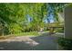 Expansive backyard with mature trees, deck, and a shed at 4902 Brookhaven Dr, Raleigh, NC 27612
