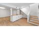 Finished basement with white cabinets and an eat-in sink area at 4902 Brookhaven Dr, Raleigh, NC 27612
