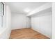 Finished basement with wood-look flooring, closet and access to other rooms at 4902 Brookhaven Dr, Raleigh, NC 27612