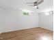 Finished basement room featuring a ceiling fan and two windows at 4902 Brookhaven Dr, Raleigh, NC 27612