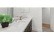 Bathroom vanity with double sinks, a large mirror, and quartz countertops at 4902 Brookhaven Dr, Raleigh, NC 27612