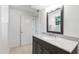 Bathroom with a vanity, stylish mirror, and door to a separate toilet room at 4902 Brookhaven Dr, Raleigh, NC 27612