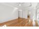 Bedroom featuring white ceiling fan, a door, two closets, and hardwood flooring at 4902 Brookhaven Dr, Raleigh, NC 27612
