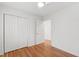 Bedroom featuring hardwood floors, a window and a closet for storage at 4902 Brookhaven Dr, Raleigh, NC 27612