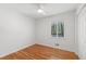 Bright bedroom with hardwood floors, a ceiling fan, and a window for natural light at 4902 Brookhaven Dr, Raleigh, NC 27612