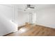 Bedroom with a ceiling fan, wood-look floors, white walls, and two closets at 4902 Brookhaven Dr, Raleigh, NC 27612
