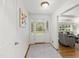 Inviting foyer with white walls, front door with sidelights, and a view into the living room at 4902 Brookhaven Dr, Raleigh, NC 27612