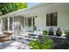 Inviting front entrance featuring a light blue door, stone steps, and elegant landscaping at 4902 Brookhaven Dr, Raleigh, NC 27612