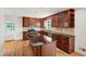 Bright kitchen with granite countertops, a kitchen island, stainless steel appliances, and ample cabinet space at 4902 Brookhaven Dr, Raleigh, NC 27612