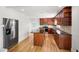 Spacious kitchen with stainless steel appliances, granite countertops, and large island for meal preparation at 4902 Brookhaven Dr, Raleigh, NC 27612