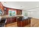 Spacious kitchen features stainless steel appliances, granite countertops, a kitchen island, and ample natural light at 4902 Brookhaven Dr, Raleigh, NC 27612