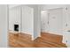 Open-concept living area showcasing hardwood floors, a fireplace, and natural light at 4902 Brookhaven Dr, Raleigh, NC 27612