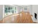 Spacious living room with a coffered ceiling, fireplace, and large windows offering natural light at 4902 Brookhaven Dr, Raleigh, NC 27612
