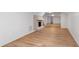 Inviting living area with brick fireplace and wood floors, offering a blend of comfort and style at 4902 Brookhaven Dr, Raleigh, NC 27612